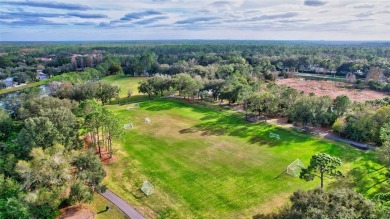 This beautifully maintained 4-bedroom home has been lovingly on Hunters Green Country Club in Florida - for sale on GolfHomes.com, golf home, golf lot