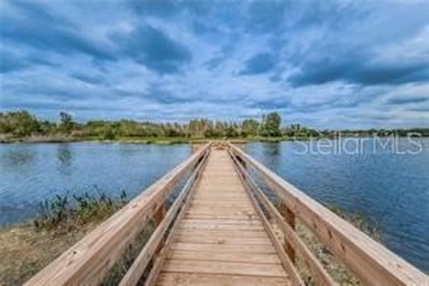 This beautifully maintained 4-bedroom home has been lovingly on Hunters Green Country Club in Florida - for sale on GolfHomes.com, golf home, golf lot