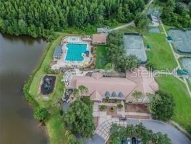 This beautifully maintained 4-bedroom home has been lovingly on Hunters Green Country Club in Florida - for sale on GolfHomes.com, golf home, golf lot