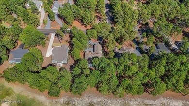 Nestled on the golf course in the gated community of Seven Lakes on Beacon Ridge Golf and Country Club in North Carolina - for sale on GolfHomes.com, golf home, golf lot