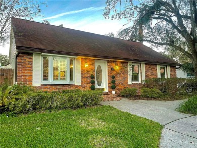 Charming brick facade 3-bedroom, 2-bath house with wood floors on Temple Terrace Golf and Country Club in Florida - for sale on GolfHomes.com, golf home, golf lot