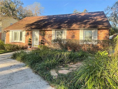 Charming brick facade 3-bedroom, 2-bath house with wood floors on Temple Terrace Golf and Country Club in Florida - for sale on GolfHomes.com, golf home, golf lot