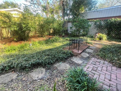 Charming brick facade 3-bedroom, 2-bath house with wood floors on Temple Terrace Golf and Country Club in Florida - for sale on GolfHomes.com, golf home, golf lot