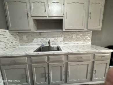Move right in to this updated 2-bedroom, 1-bath end unit in on Greenbriar Woodlands in New Jersey - for sale on GolfHomes.com, golf home, golf lot