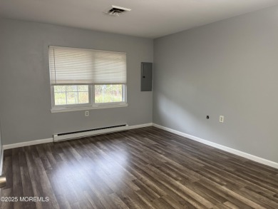 Move right in to this updated 2-bedroom, 1-bath end unit in on Greenbriar Woodlands in New Jersey - for sale on GolfHomes.com, golf home, golf lot