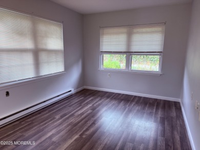 Move right in to this updated 2-bedroom, 1-bath end unit in on Greenbriar Woodlands in New Jersey - for sale on GolfHomes.com, golf home, golf lot