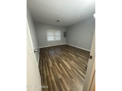 Move right in to this updated 2-bedroom, 1-bath end unit in on Greenbriar Woodlands in New Jersey - for sale on GolfHomes.com, golf home, golf lot