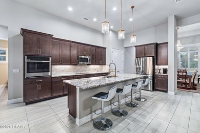 Welcome to 301 Stirling Bridge Drive, where breathtaking western on Plantation Bay Golf and Country Club in Florida - for sale on GolfHomes.com, golf home, golf lot