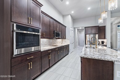 Welcome to 301 Stirling Bridge Drive, where breathtaking western on Plantation Bay Golf and Country Club in Florida - for sale on GolfHomes.com, golf home, golf lot