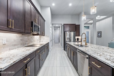 Welcome to 301 Stirling Bridge Drive, where breathtaking western on Plantation Bay Golf and Country Club in Florida - for sale on GolfHomes.com, golf home, golf lot