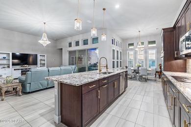 Welcome to 301 Stirling Bridge Drive, where breathtaking western on Plantation Bay Golf and Country Club in Florida - for sale on GolfHomes.com, golf home, golf lot