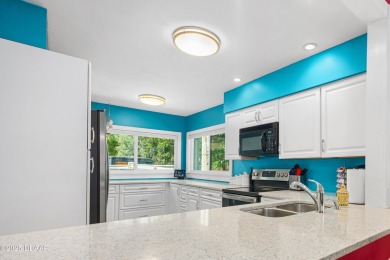 Immaculate 2BR/2BA End Unit with Golf Course Views on a Quiet on The Club At Pelican Bay - North Course in Florida - for sale on GolfHomes.com, golf home, golf lot