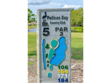 Immaculate 2BR/2BA End Unit with Golf Course Views on a Quiet on The Club At Pelican Bay - North Course in Florida - for sale on GolfHomes.com, golf home, golf lot