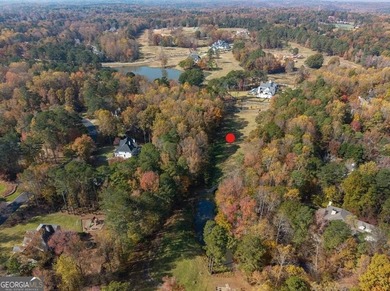 Discover this former golf fairway - now stunning 4.2-acre on Trophy Club of Atlanta in Georgia - for sale on GolfHomes.com, golf home, golf lot