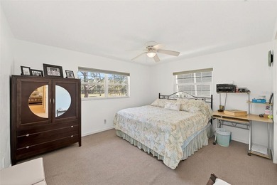 Wake up to sweeping golf course views in this bright, breezy on East Bay Golf Club in Florida - for sale on GolfHomes.com, golf home, golf lot