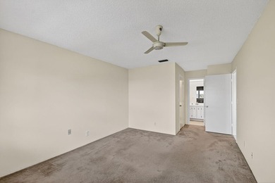 Lake & fountain views from both bedrooms & patio. Front patio & on Cypress Lakes Golf Course - West Palm Beach in Florida - for sale on GolfHomes.com, golf home, golf lot