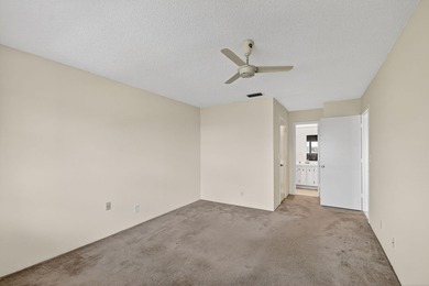 Lake & fountain views from both bedrooms & patio. Front patio & on Cypress Lakes Golf Course - West Palm Beach in Florida - for sale on GolfHomes.com, golf home, golf lot