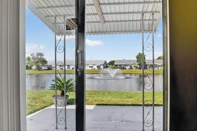Lake & fountain views from both bedrooms & patio. Front patio & on Cypress Lakes Golf Course - West Palm Beach in Florida - for sale on GolfHomes.com, golf home, golf lot