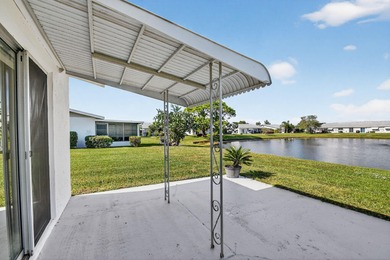 Lake & fountain views from both bedrooms & patio. Front patio & on Cypress Lakes Golf Course - West Palm Beach in Florida - for sale on GolfHomes.com, golf home, golf lot