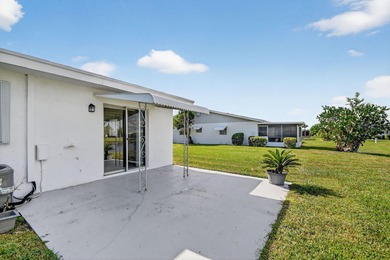 Lake & fountain views from both bedrooms & patio. Front patio & on Cypress Lakes Golf Course - West Palm Beach in Florida - for sale on GolfHomes.com, golf home, golf lot