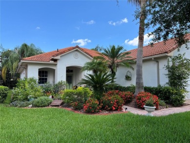 Beautifully maintained home in Solivita. Gorgeous landscaping on Stonegate Golf Club in Florida - for sale on GolfHomes.com, golf home, golf lot