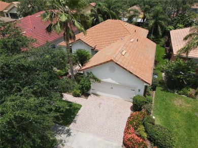 Beautifully maintained home in Solivita. Gorgeous landscaping on Stonegate Golf Club in Florida - for sale on GolfHomes.com, golf home, golf lot
