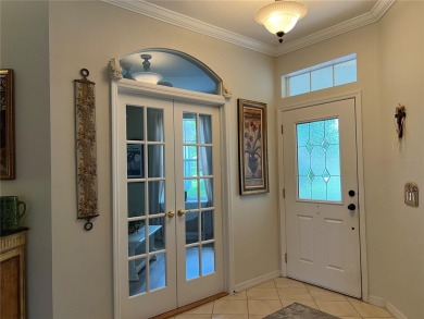 Beautifully maintained home in Solivita. Gorgeous landscaping on Stonegate Golf Club in Florida - for sale on GolfHomes.com, golf home, golf lot