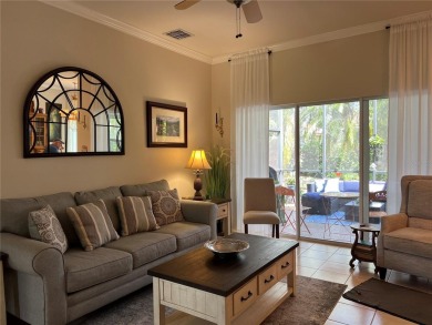Beautifully maintained home in Solivita. Gorgeous landscaping on Stonegate Golf Club in Florida - for sale on GolfHomes.com, golf home, golf lot
