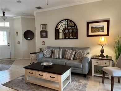 Beautifully maintained home in Solivita. Gorgeous landscaping on Stonegate Golf Club in Florida - for sale on GolfHomes.com, golf home, golf lot