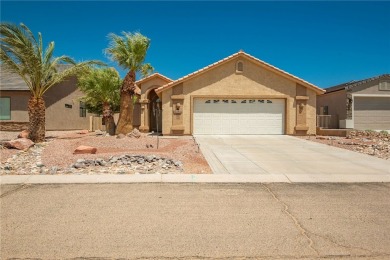 Located at 5832 S Wishing Well Dr, Fort Mohave, Arizona, this on Desert Lakes Golf Course in Arizona - for sale on GolfHomes.com, golf home, golf lot