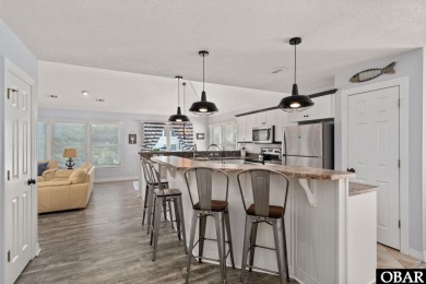 This vacation rental home is a spacious 4-bedroom, 4.5-bathroom on The Currituck Golf Club in North Carolina - for sale on GolfHomes.com, golf home, golf lot