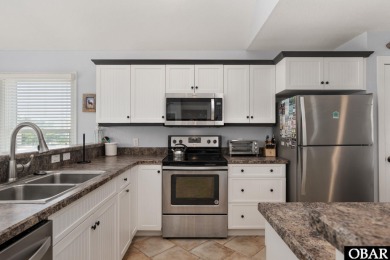 This vacation rental home is a spacious 4-bedroom, 4.5-bathroom on The Currituck Golf Club in North Carolina - for sale on GolfHomes.com, golf home, golf lot