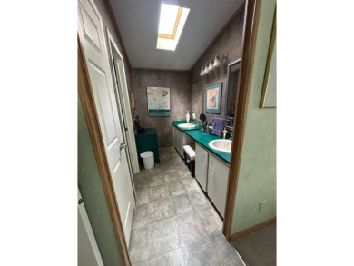 Step into this exceptional, FULLY FURNISHED (TURN KEY) 2-bedroom on Schalamar Creek Golf and Country Club in Florida - for sale on GolfHomes.com, golf home, golf lot