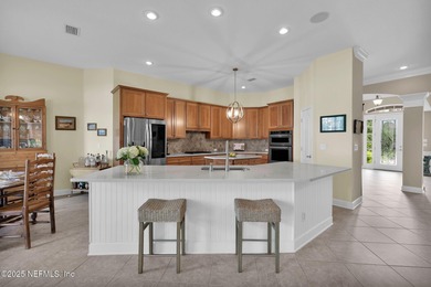 This elegant David Weekley home offers panoramic water views on The Palencia Club in Florida - for sale on GolfHomes.com, golf home, golf lot