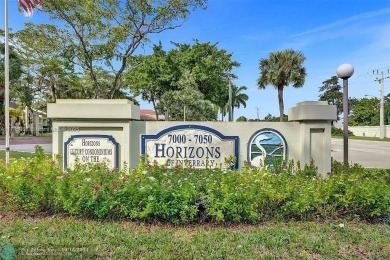 This spacious 2-bedroom condo features laminate wood flooring on Inverrary Country Club in Florida - for sale on GolfHomes.com, golf home, golf lot