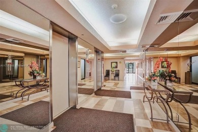 This spacious 2-bedroom condo features laminate wood flooring on Inverrary Country Club in Florida - for sale on GolfHomes.com, golf home, golf lot