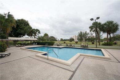 This spacious 2-bedroom condo features laminate wood flooring on Inverrary Country Club in Florida - for sale on GolfHomes.com, golf home, golf lot