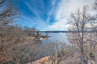Experience stunning lakefront living on Loch Lomond in this on Bella Vista Country Club - Scottsdale in Arkansas - for sale on GolfHomes.com, golf home, golf lot