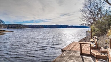 Experience stunning lakefront living on Loch Lomond in this on Bella Vista Country Club - Scottsdale in Arkansas - for sale on GolfHomes.com, golf home, golf lot