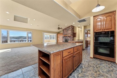 Experience stunning lakefront living on Loch Lomond in this on Bella Vista Country Club - Scottsdale in Arkansas - for sale on GolfHomes.com, golf home, golf lot