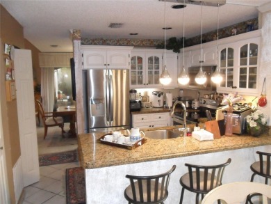 Single-family home in DORAL PARK on a premium lot overlooking on Jim McLean Signature Course in Florida - for sale on GolfHomes.com, golf home, golf lot
