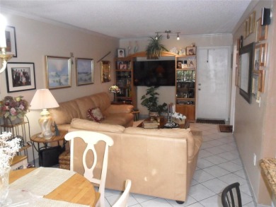 Single-family home in DORAL PARK on a premium lot overlooking on Jim McLean Signature Course in Florida - for sale on GolfHomes.com, golf home, golf lot