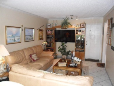 Single-family home in DORAL PARK on a premium lot overlooking on Jim McLean Signature Course in Florida - for sale on GolfHomes.com, golf home, golf lot