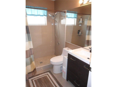 Single-family home in DORAL PARK on a premium lot overlooking on Jim McLean Signature Course in Florida - for sale on GolfHomes.com, golf home, golf lot
