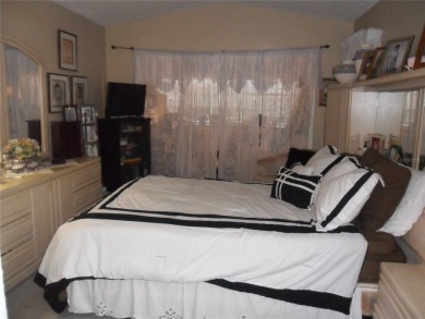 Single-family home in DORAL PARK on a premium lot overlooking on Jim McLean Signature Course in Florida - for sale on GolfHomes.com, golf home, golf lot