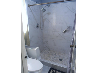 Single-family home in DORAL PARK on a premium lot overlooking on Jim McLean Signature Course in Florida - for sale on GolfHomes.com, golf home, golf lot
