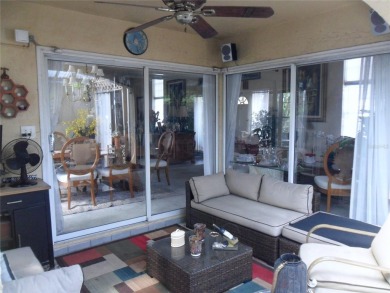 Single-family home in DORAL PARK on a premium lot overlooking on Jim McLean Signature Course in Florida - for sale on GolfHomes.com, golf home, golf lot
