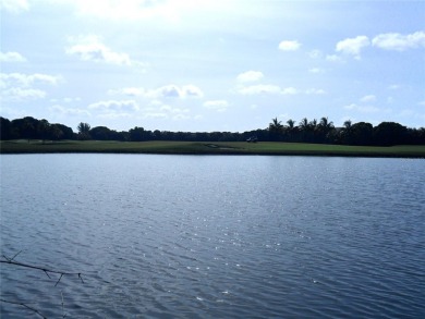 Single-family home in DORAL PARK on a premium lot overlooking on Jim McLean Signature Course in Florida - for sale on GolfHomes.com, golf home, golf lot