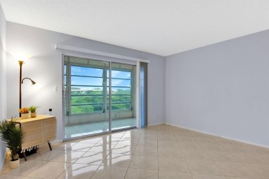 This top-floor condo is situated in Wynmoor's golf community and on Wynmoor Golf Course in Florida - for sale on GolfHomes.com, golf home, golf lot