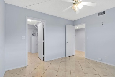 This top-floor condo is situated in Wynmoor's golf community and on Wynmoor Golf Course in Florida - for sale on GolfHomes.com, golf home, golf lot